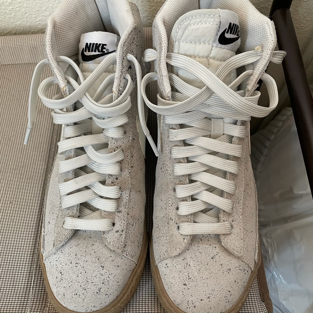 Tan and white high top Nikes